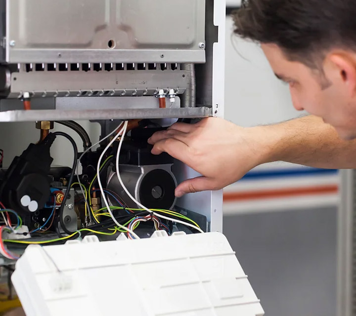 Technician on an emergency boiler service call